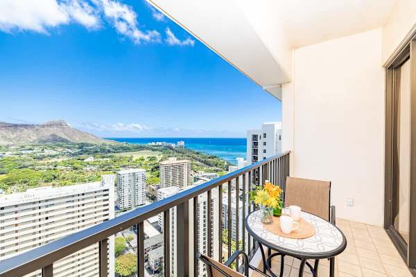 Relax on the balcony with panoramic ocean and mountain views.