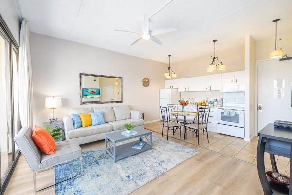 Bright living area with modern kitchen and dining space for a comfortable stay.