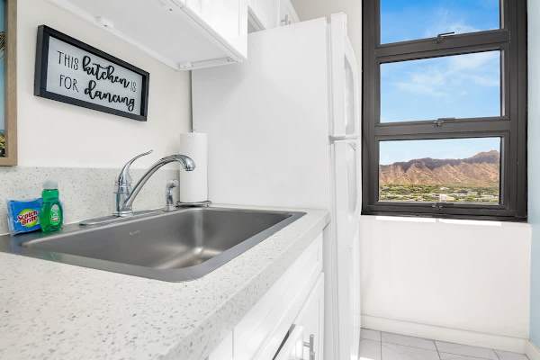kitchen sink area with a view of the mountains through the window