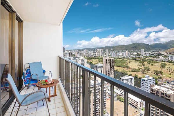 Relax on the balcony with panoramic city and mountain views.