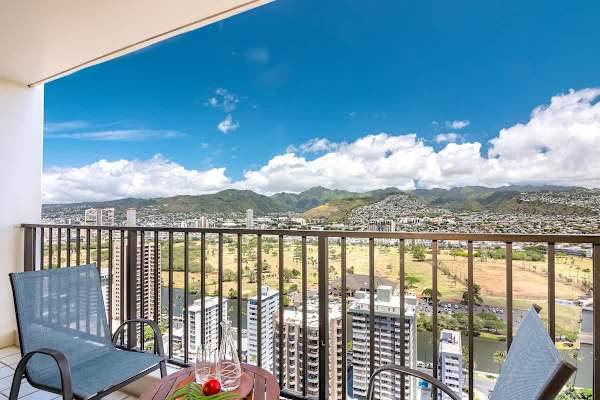 Relax on the balcony with panoramic mountain and city views.