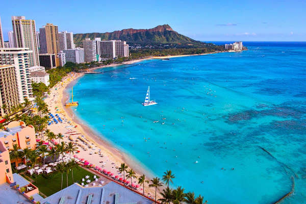 Imagine waking up to this vibrant view, just steps away from the iconic Waikiki Beach – your perfect Hawaiian getaway starts here!
