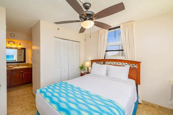 Bedroom with queen size bed and Ocean Views, spit AC and ceiling fan