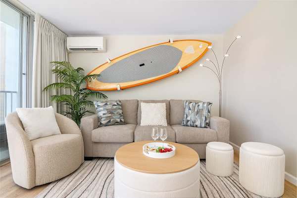 Sleeper sofa in the living area. The surfboard is display only.
