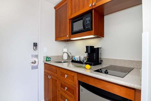 Kitchenette with 2 burner glass-top, minifridge, microwave, coffee maker, toaster, kettle