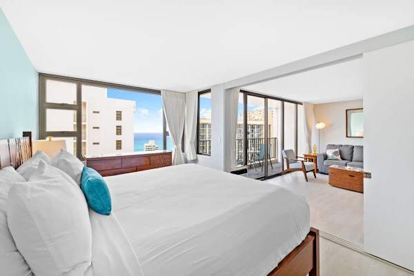 The bedroom has a sliding door that separates from the living room.