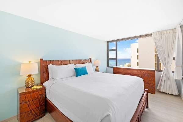 The bedroom features a king-size bed, 2 nightstands, and a closet!