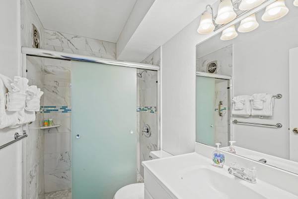 Refresh in your full bathroom with a walk-in shower.