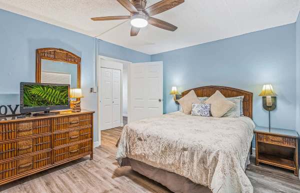 Relax in your bedroom with a Queen-size bed after a day of exploring the island.