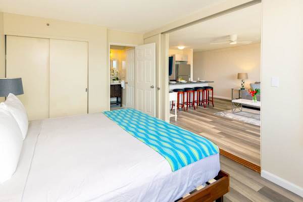 Bedroom can be closed off from the living room with a sliding panel door