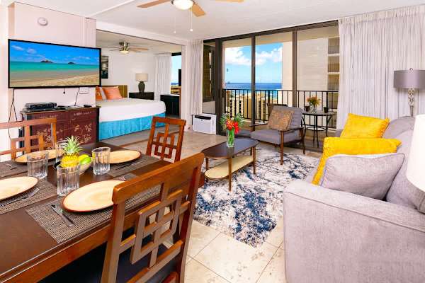 Living room with a dining area and a flat screen TV