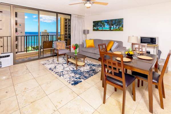 Living room with ocean views, pull out sleeper sofa and dining area