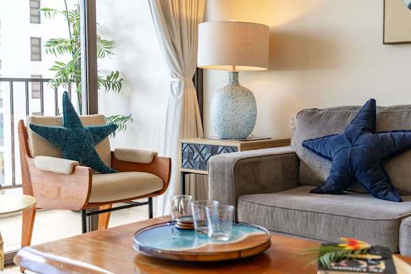 Sink into the plush sofa and unwind with a good book or a refreshing drink.