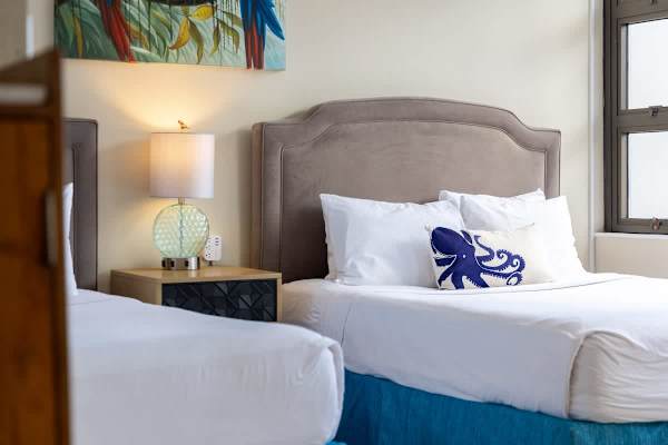 After a day in the sun, relax in your bedroom with 2 queen beds while enjoying the view from your window.