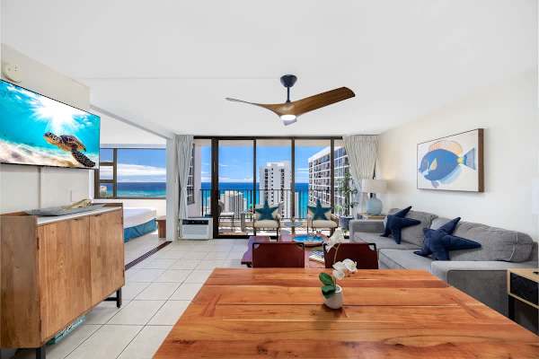 Relax on the comfortable sofa, dine at the wooden table, and take in the stunning view right next to your 48-inch Smart TV.