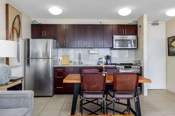 Your full kitchen and dining area are ready! Whip up a feast with modern appliances and gather around the spacious table for memories.