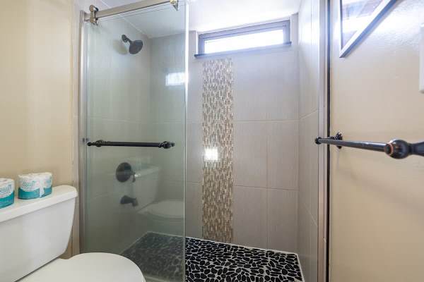 Bathroom with walk-in shower.