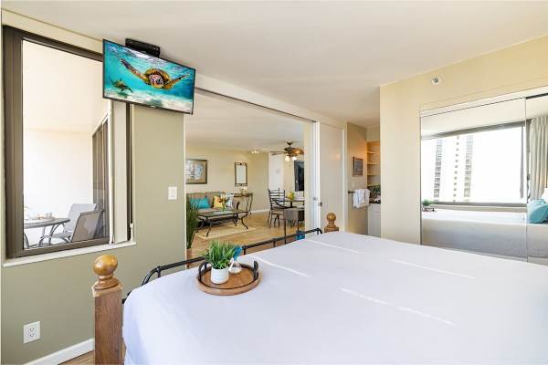 Bedroom is separate from the living room by sliding door