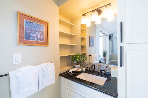 Bathroom with vanity and cabinet.
