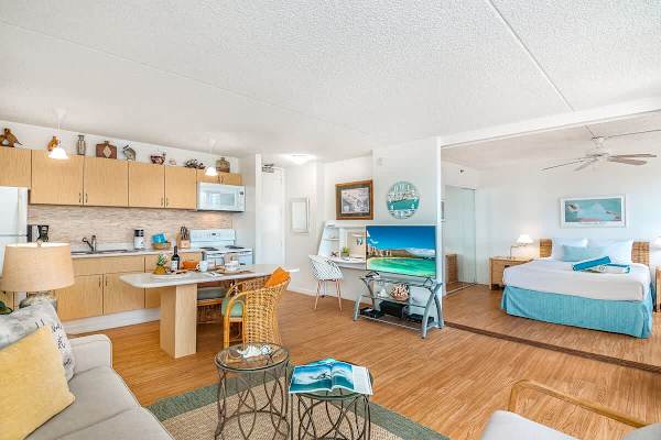 Spacious living area with flatscreen TV.