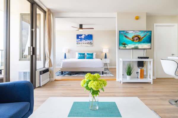 Living room is separate from bedroom by sliding door that can be completely closed 