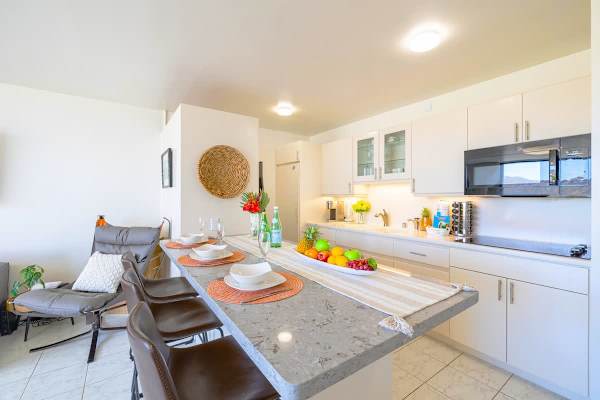 Fully equipped kitchen with microwave, cook top, fridge and washer and dryer