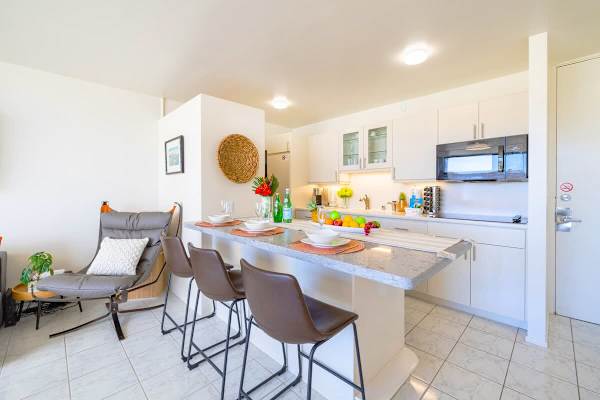 Fully equipped kitchen with microwave, cook top, fridge and washer and dryer