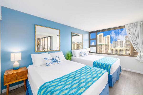 Bedroom with two Queen-size beds. Closet and access to the bathroom