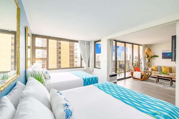 Bedroom with sliding door separating the living room from the bedroom 