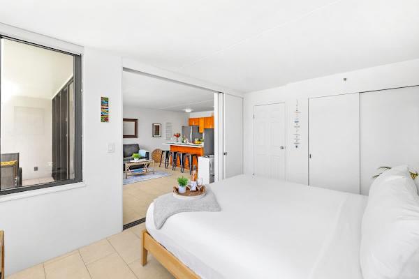 Sliding door separates the living room from the bedroom 
