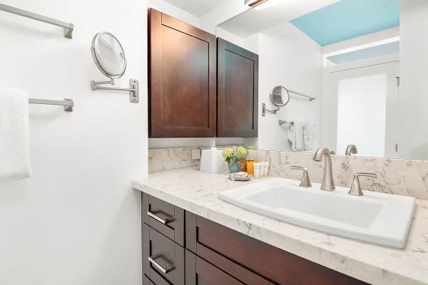 Full bathroom with vanity and cabinet.