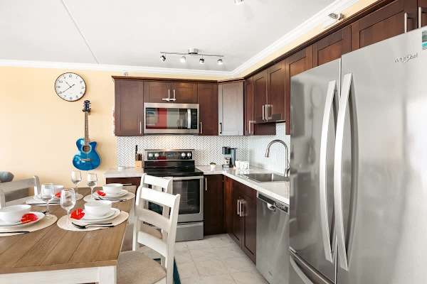Cook delicious meals in your fully equipped kitchen with full-size appliances, and with dishwasher. Plus, share them with loved ones at your dining table with 4 chairs.