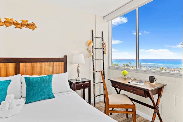 Bedroom with King-size bed and dedicate work space.