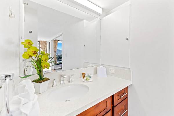 Bathroom with vanity and cabinet