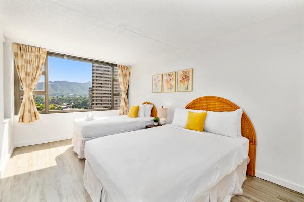 Relax in your bedroom with 1 queen-size and 1 twin-size bed, and a beautiful mountain view.