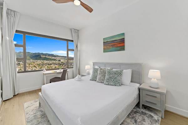 Bedroom with King-size bed, nightstands and beautiful mountain views.