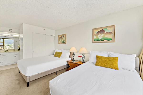 Bedroom with one queen-size and one full-size bed. Access to the bathroom 