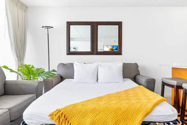 Sofa bed pulled out, linens are included