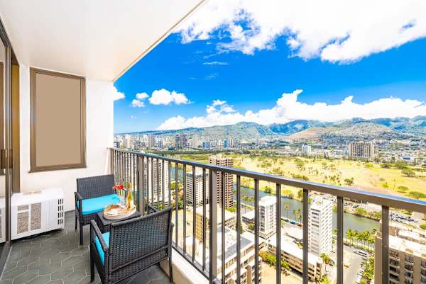 Relax on the balcony with panoramic city and mountain views.
