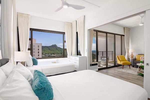 The bedroom has 1 queen-size and 1 full-size bed