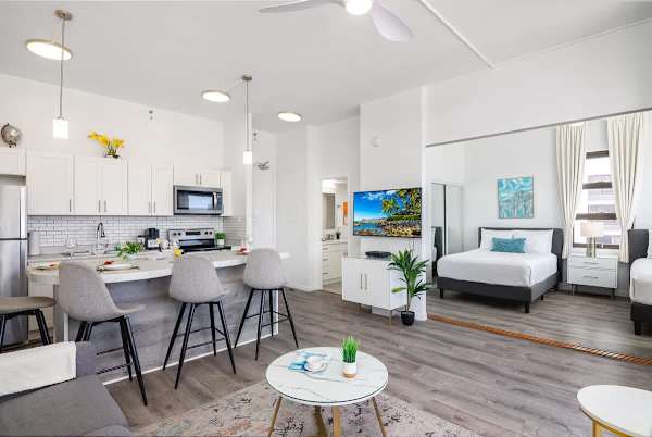 Overview of the living area, dining area, and kitchen