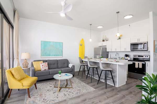 Overview of the living room, dining area, and kitchen