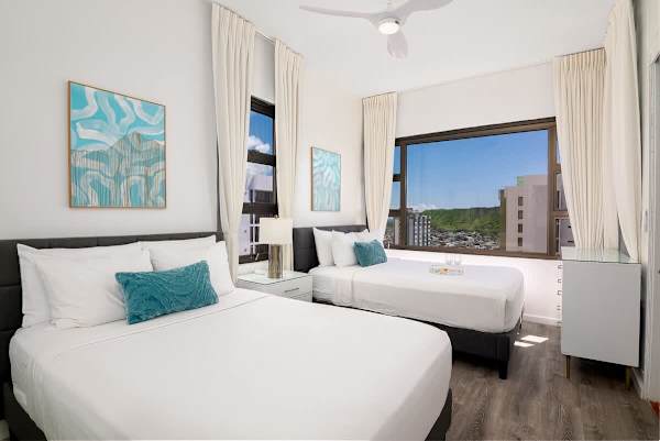 Airy bedroom with queen-size and full-size beds