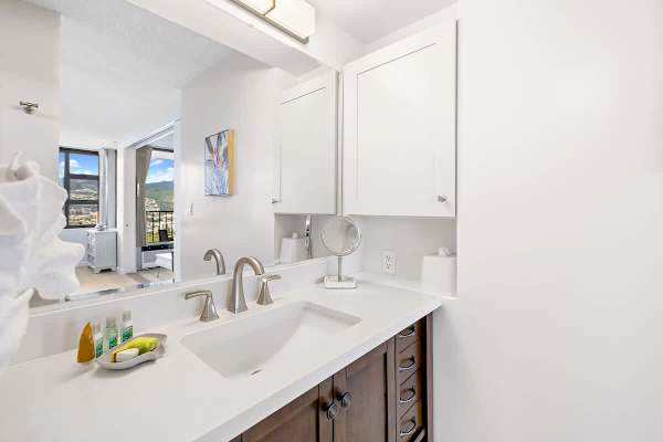 The full bathroom has vanity with cabinet!