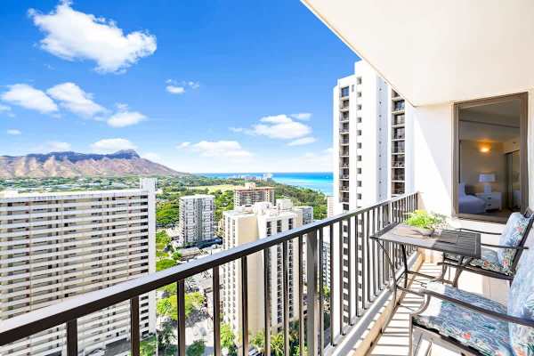 Relax on the balcony with panoramic views of the city, mountains, and ocean.