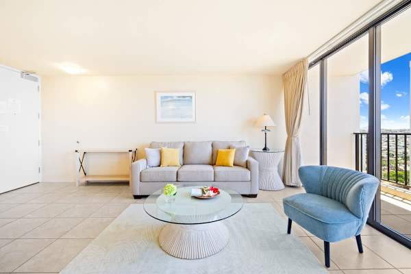 Bright living room with modern seating and balcony views