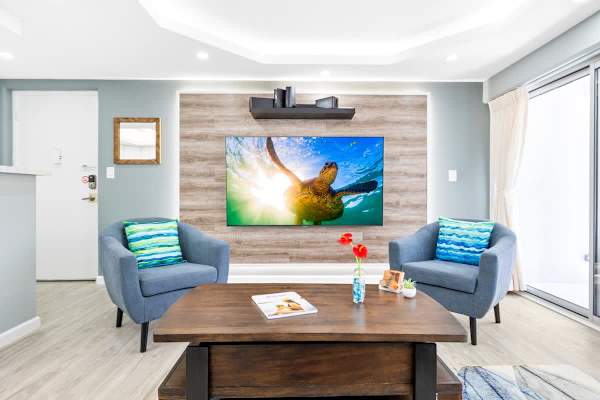 The living room features 75" flat screen TV perfect for your entertainment needs!