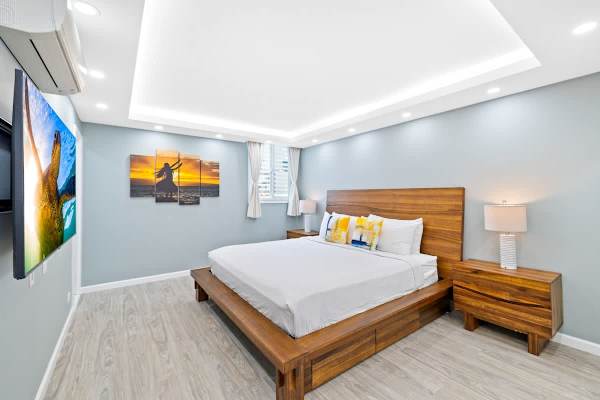 Relax on your king-size bed while watching TV in the master bedroom!