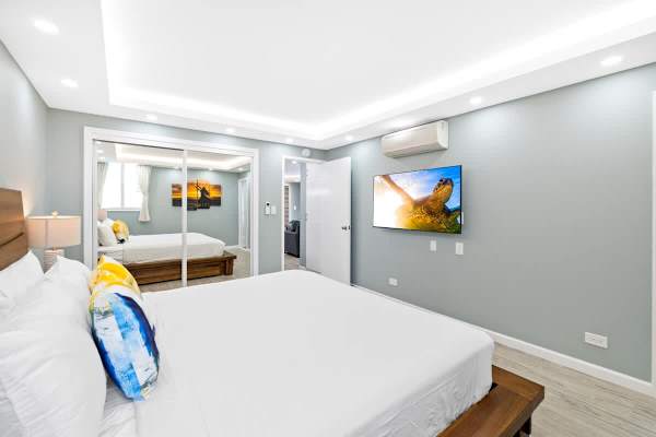 Enjoy watching your favorite shows while resting on a king-size bed in the master bedroom!