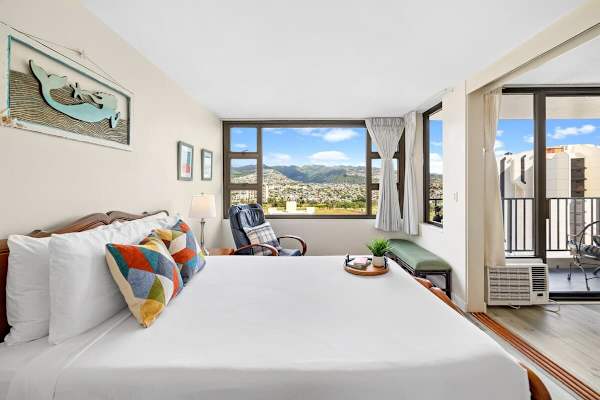 Bedroom with queen-size bed and  mountain view